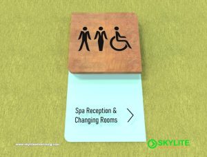 designed by benc restroom sign laser cut on wood with acrylic backing